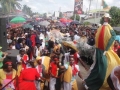 In the foreground is Tall Lady. Photograph from Mondale Smith's 2009 article, %22Essequibo Bad Cow Masquerade attracts thousands%22 (Kaiteur News, December 22, 2009)