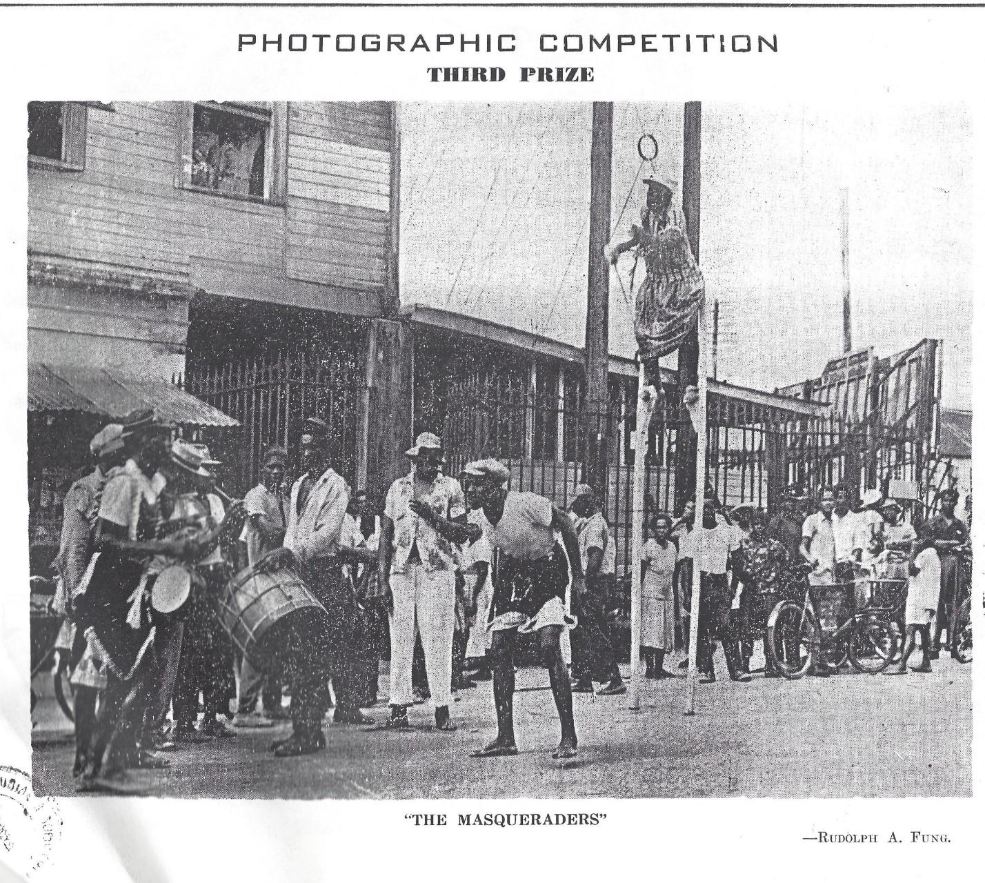 “The Masqueraders” by Rudolph A. Fung
The earliest image of Masquerade in this exhibition is a photocopy of Rudolph A. Fung’s prize-winning photograph “The Masqueraders” in the 1958 Chronicle Christmas Annual.  What catches your attention ?